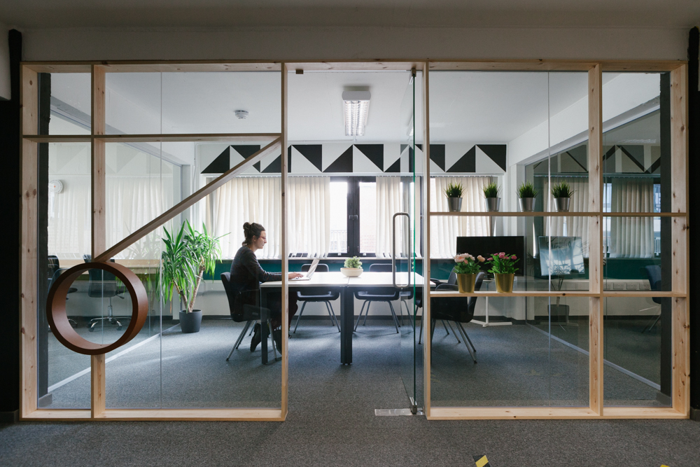 Image of one person in a large meeting room